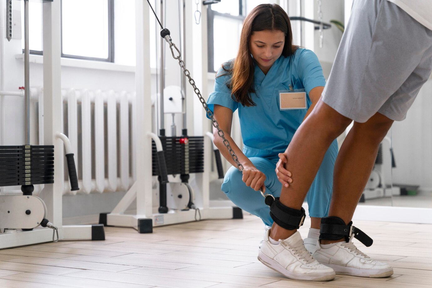 medical-assistant-helping-patient-with-physiotherapy-exercises_23-2149071467